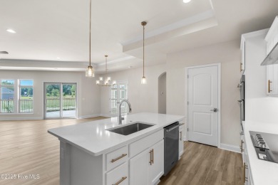 Ranch living at its best in this Promenade III Plan with on Ocean Ridge Plantation in North Carolina - for sale on GolfHomes.com, golf home, golf lot