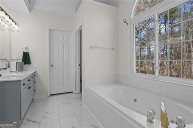 Welcome home to this timeless brick traditional nestled at the on Brookstone Golf and Country Club in Georgia - for sale on GolfHomes.com, golf home, golf lot