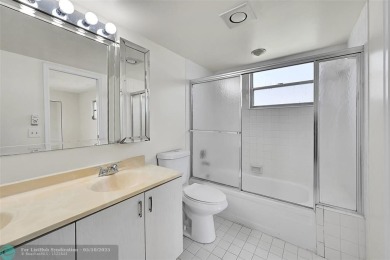 ARUBA VILLAGE IN THE HEART OF WYNMOOR WITH PANORAMIC GOLF COURSE on Wynmoor Golf Course in Florida - for sale on GolfHomes.com, golf home, golf lot