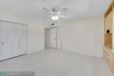 ARUBA VILLAGE IN THE HEART OF WYNMOOR WITH PANORAMIC GOLF COURSE on Wynmoor Golf Course in Florida - for sale on GolfHomes.com, golf home, golf lot