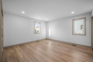 This beautifully renovated 6 bedroom 4 bath modern chic duplex on Ocean City Muni Golf Course in New Jersey - for sale on GolfHomes.com, golf home, golf lot