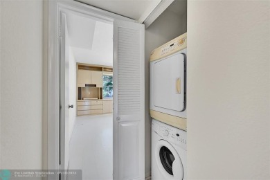 ARUBA VILLAGE IN THE HEART OF WYNMOOR WITH PANORAMIC GOLF COURSE on Wynmoor Golf Course in Florida - for sale on GolfHomes.com, golf home, golf lot