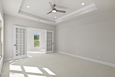 LOT 9 - Ranch living at its best in this Promenade III Plan with on Ocean Ridge Plantation in North Carolina - for sale on GolfHomes.com, golf home, golf lot