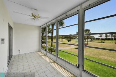 ARUBA VILLAGE IN THE HEART OF WYNMOOR WITH PANORAMIC GOLF COURSE on Wynmoor Golf Course in Florida - for sale on GolfHomes.com, golf home, golf lot