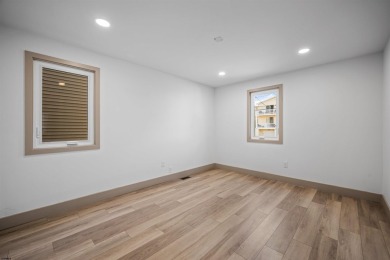 This beautifully renovated 6 bedroom 4 bath modern chic duplex on Ocean City Muni Golf Course in New Jersey - for sale on GolfHomes.com, golf home, golf lot