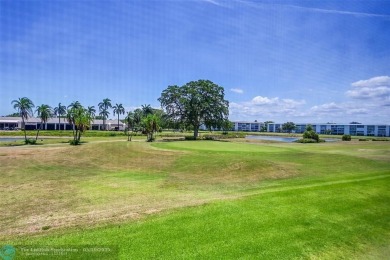 ARUBA VILLAGE IN THE HEART OF WYNMOOR WITH PANORAMIC GOLF COURSE on Wynmoor Golf Course in Florida - for sale on GolfHomes.com, golf home, golf lot