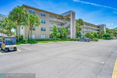 ARUBA VILLAGE IN THE HEART OF WYNMOOR WITH PANORAMIC GOLF COURSE on Wynmoor Golf Course in Florida - for sale on GolfHomes.com, golf home, golf lot