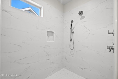 Ranch living at its best in this Promenade III Plan with on Ocean Ridge Plantation in North Carolina - for sale on GolfHomes.com, golf home, golf lot