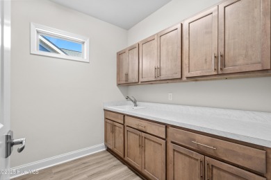 Ranch living at its best in this Promenade III Plan with on Ocean Ridge Plantation in North Carolina - for sale on GolfHomes.com, golf home, golf lot