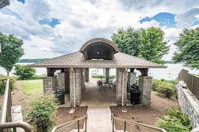 Enjoy the main lake views from spectacular corner condo in on The Golf Club at Cuscowilla in Georgia - for sale on GolfHomes.com, golf home, golf lot