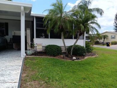 Tremendous 3-bedroom 2-bath located on the 9th fairway at Four on Four Lakes Golf Club in Florida - for sale on GolfHomes.com, golf home, golf lot