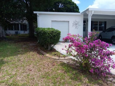 Tremendous 3-bedroom 2-bath located on the 9th fairway at Four on Four Lakes Golf Club in Florida - for sale on GolfHomes.com, golf home, golf lot