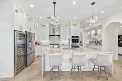 Stunning lake and golf course views in prestigious Marsala on Tiburon Golf Club in Florida - for sale on GolfHomes.com, golf home, golf lot