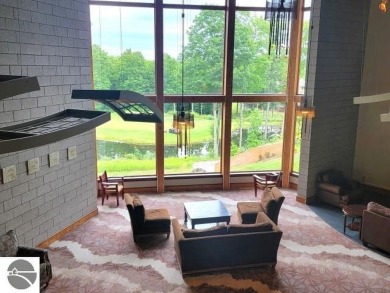 This furnished ground level suite is an ideal spot to enjoy all on Cedar River Golf Course in Michigan - for sale on GolfHomes.com, golf home, golf lot