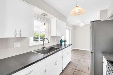 Welcome to this beautifully updated 2-bedroom, 1.5-bath home on Highland Lakes Executive Golf Course in Florida - for sale on GolfHomes.com, golf home, golf lot