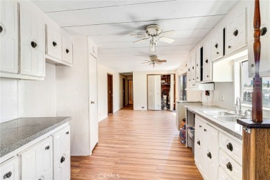 This 3-bedroom, 2-bath home offers 1,380 sq ft on a 6,811 sq ft on Green Tree Golf Course in California - for sale on GolfHomes.com, golf home, golf lot