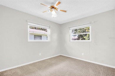 Welcome to this beautifully updated 2-bedroom, 1.5-bath home on Highland Lakes Executive Golf Course in Florida - for sale on GolfHomes.com, golf home, golf lot