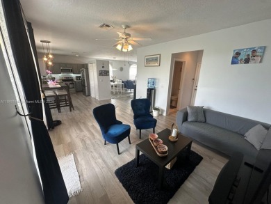 Beautiful lakefront single-family home in the sought-after Grand on Palm Beach Polo and Country Club in Florida - for sale on GolfHomes.com, golf home, golf lot