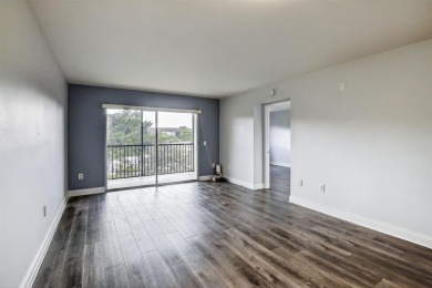 Beautifully Renovated, Spacious 2-Bed/2-Bath, Garden/pool area on Flamingo Lakes Country Club in Florida - for sale on GolfHomes.com, golf home, golf lot