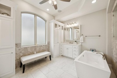 Discover refined living in this immaculate four-bedroom on Lantana Golf Club in Texas - for sale on GolfHomes.com, golf home, golf lot