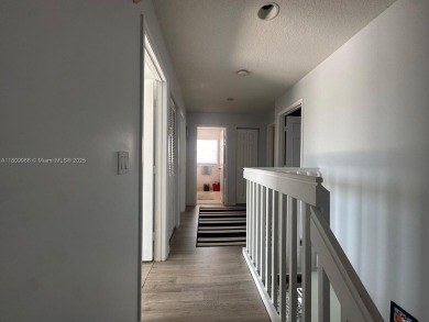 Beautiful lakefront single-family home in the sought-after Grand on Palm Beach Polo and Country Club in Florida - for sale on GolfHomes.com, golf home, golf lot