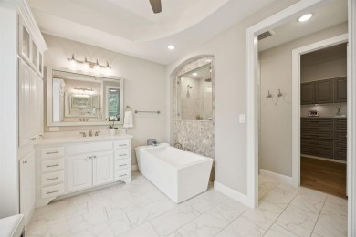 Discover refined living in this immaculate four-bedroom on Lantana Golf Club in Texas - for sale on GolfHomes.com, golf home, golf lot