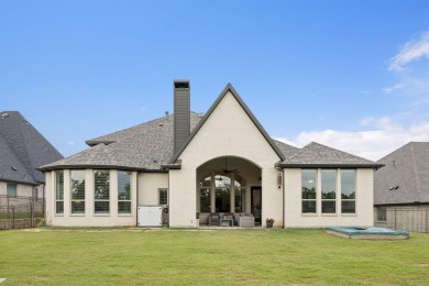 Discover refined living in this immaculate four-bedroom on Lantana Golf Club in Texas - for sale on GolfHomes.com, golf home, golf lot