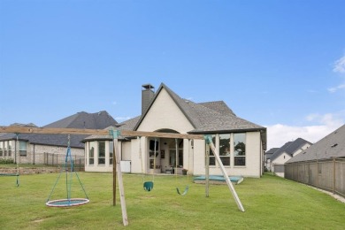Discover refined living in this immaculate four-bedroom on Lantana Golf Club in Texas - for sale on GolfHomes.com, golf home, golf lot