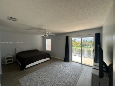 Beautiful lakefront single-family home in the sought-after Grand on Palm Beach Polo and Country Club in Florida - for sale on GolfHomes.com, golf home, golf lot