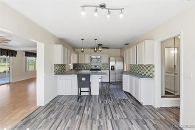 Discover this spacious 4-bed, 3-bath home at 818 N Country Club on Plantation Inn and Golf Resort  in Florida - for sale on GolfHomes.com, golf home, golf lot