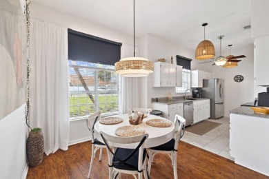 Nestled within Bid-A-Wee, a golf-cart friendly community of on Holiday Golf Club in Florida - for sale on GolfHomes.com, golf home, golf lot