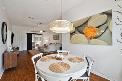 Nestled within Bid-A-Wee, a golf-cart friendly community of on Holiday Golf Club in Florida - for sale on GolfHomes.com, golf home, golf lot