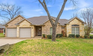 Nestled in a highly desirable gated community offering on Pecan Plantation Country Club in Texas - for sale on GolfHomes.com, golf home, golf lot