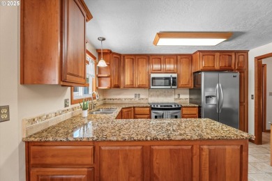 Tucked beside Mallard Creek Golf Course and surrounded by on Mallard Creek Golf and RV Resort in Oregon - for sale on GolfHomes.com, golf home, golf lot