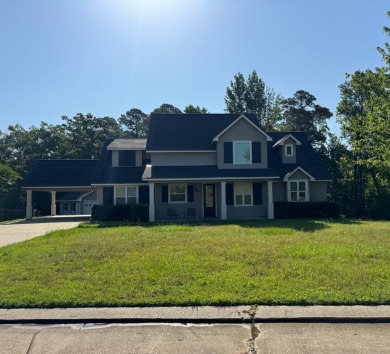 This beautiful 2 story home in Bailey's Bluff isa golf cart ride on Cypress Bend Golf Resort in Louisiana - for sale on GolfHomes.com, golf home, golf lot