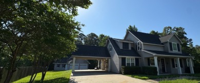 This beautiful 2 story home in Bailey's Bluff isa golf cart ride on Cypress Bend Golf Resort in Louisiana - for sale on GolfHomes.com, golf home, golf lot