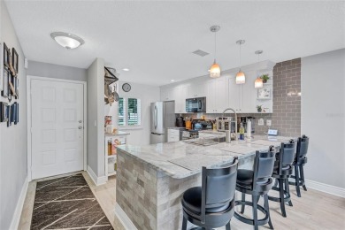 Gorgeous end-unit villa in a prime location with stunning on Highland Lakes Executive Golf Course in Florida - for sale on GolfHomes.com, golf home, golf lot
