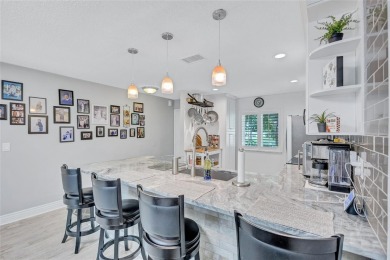Gorgeous end-unit villa in a prime location with stunning on Highland Lakes Executive Golf Course in Florida - for sale on GolfHomes.com, golf home, golf lot