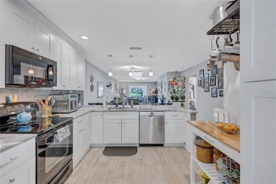 Gorgeous end-unit villa in a prime location with stunning on Highland Lakes Executive Golf Course in Florida - for sale on GolfHomes.com, golf home, golf lot