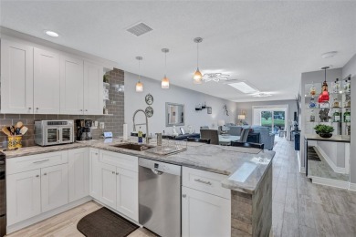 Gorgeous end-unit villa in a prime location with stunning on Highland Lakes Executive Golf Course in Florida - for sale on GolfHomes.com, golf home, golf lot