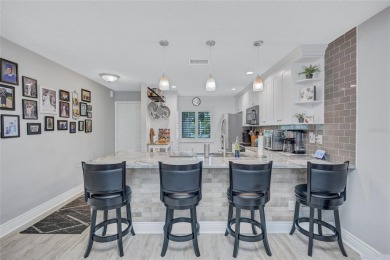 Gorgeous end-unit villa in a prime location with stunning on Highland Lakes Executive Golf Course in Florida - for sale on GolfHomes.com, golf home, golf lot