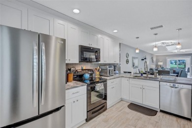 Gorgeous end-unit villa in a prime location with stunning on Highland Lakes Executive Golf Course in Florida - for sale on GolfHomes.com, golf home, golf lot