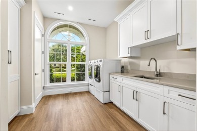 AN EXCEPTIONAL 2023 CUSTOM TRANSFORMATION OF THIS LAKEFRONT HOME on Grand Harbor Golf and Country Club in Florida - for sale on GolfHomes.com, golf home, golf lot