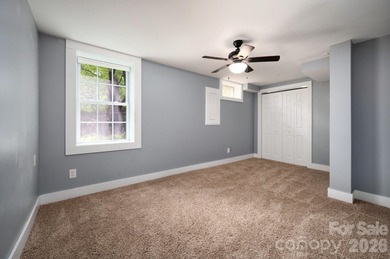 Perched above the Black Mountain Golf Club and nestled within a on Black Mountain Golf Course in North Carolina - for sale on GolfHomes.com, golf home, golf lot