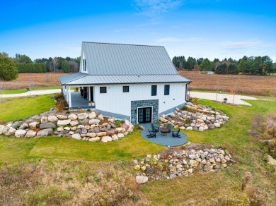 Discover luxury and serenity in this stunning new custom-built on CNC Links in Wisconsin - for sale on GolfHomes.com, golf home, golf lot