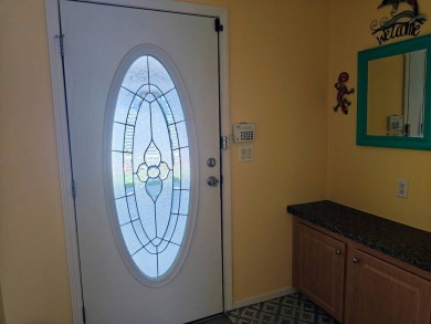 This incredible floor plan has an entry foyer and includes an on Southport Springs Golf Club in Florida - for sale on GolfHomes.com, golf home, golf lot