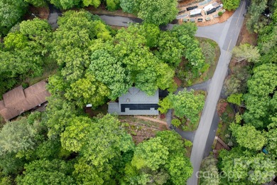 Perched above the Black Mountain Golf Club and nestled within a on Black Mountain Golf Course in North Carolina - for sale on GolfHomes.com, golf home, golf lot
