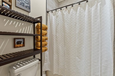 Stunning 2023 custom one-story home on a beautifully treed on Cedar Creek Country Club in Texas - for sale on GolfHomes.com, golf home, golf lot