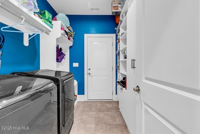 Welcome to exceptional living at 3032 Eno Lane, a custom-built on Cape Fear National At Brunswick Forest in North Carolina - for sale on GolfHomes.com, golf home, golf lot