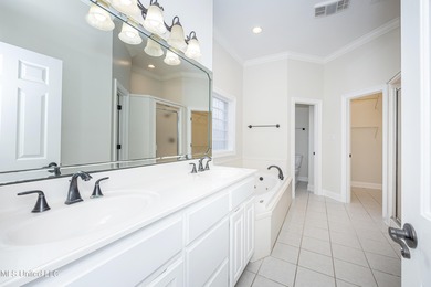 Elegant updated home in the highly sought after Diamondhead on Diamondhead Country Club in Mississippi - for sale on GolfHomes.com, golf home, golf lot